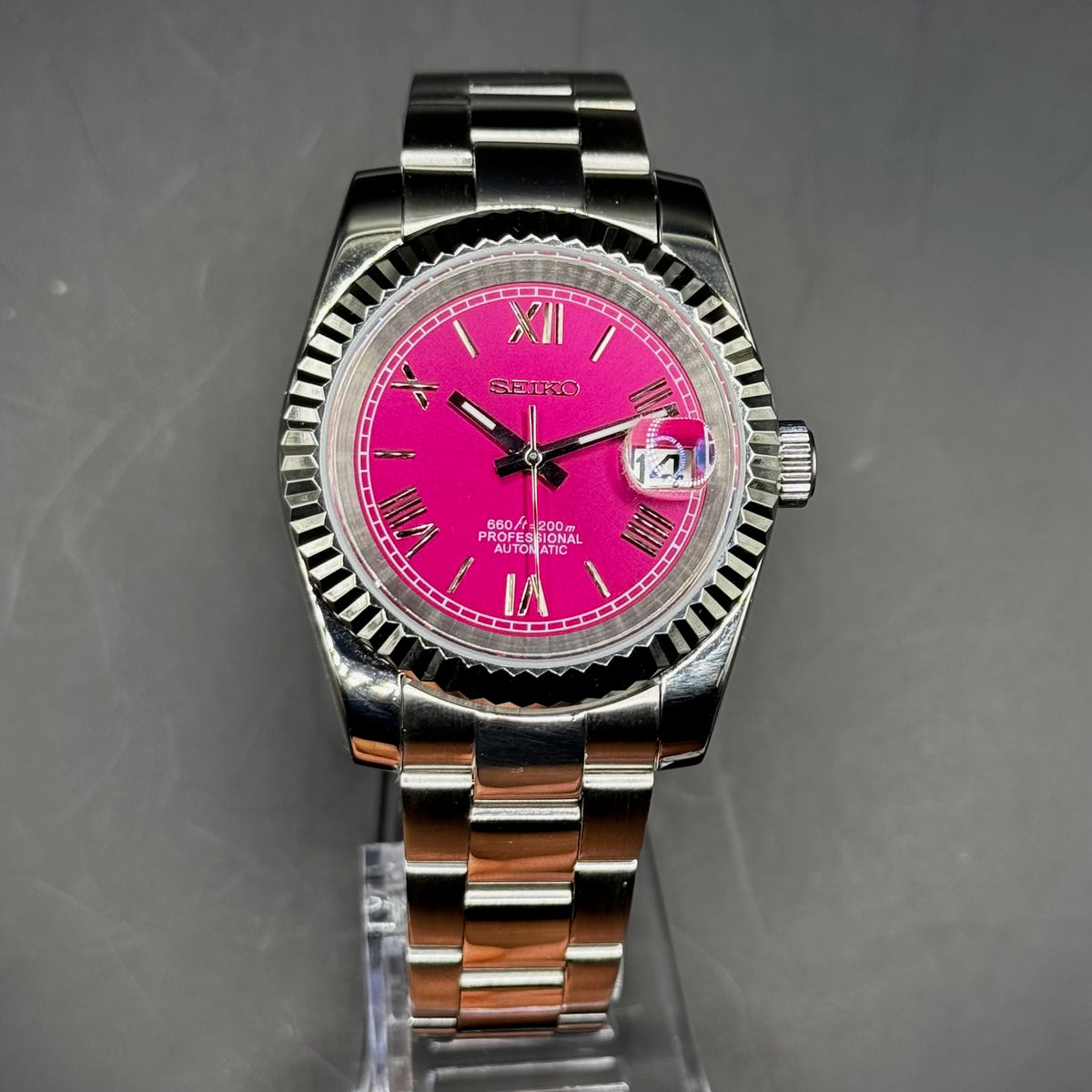 Seiko Roman Chrome Purple 39mm watch on a display stand
