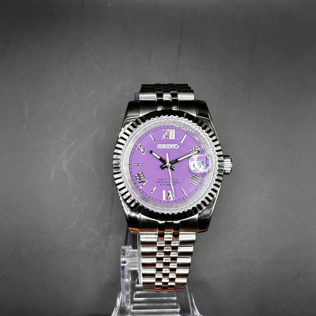 Seiko Roman Purple 39mm watch on a display stand