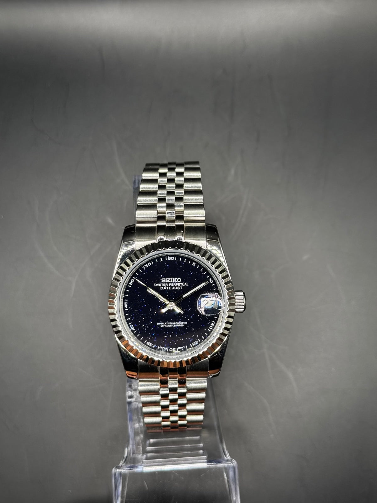 Seiko Stardust 36mm watch on a display stand
